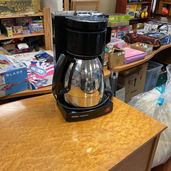 Black vintage Krups CompacTherm coffee machine with glass carafe.