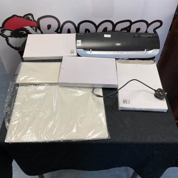 Gbc office laminator with laminating pouches and sheets.