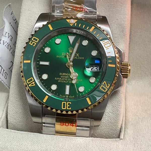 Front view of a green Rolex Submariner style automatic wristwatch.