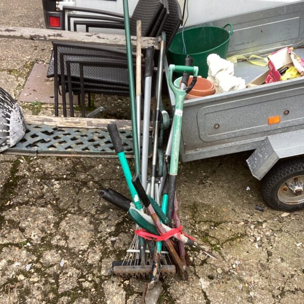 Garden tool bundle displayed in the back of a Fiat Ducato van.