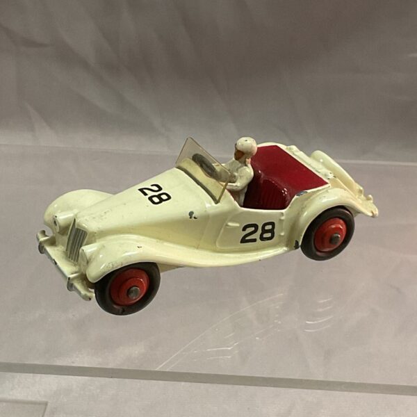 Side view of a vintage Dinky Toys MG Midget diecast car.