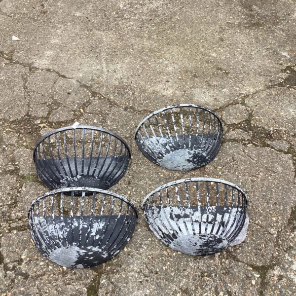 Lot of four vintage metal wall baskets for garden or home decor.