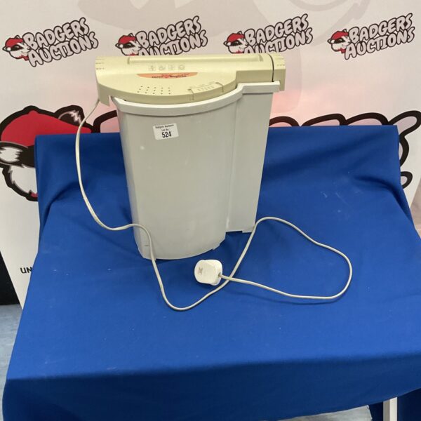 Light blue Paper Monster Junior paper shredder for document security.