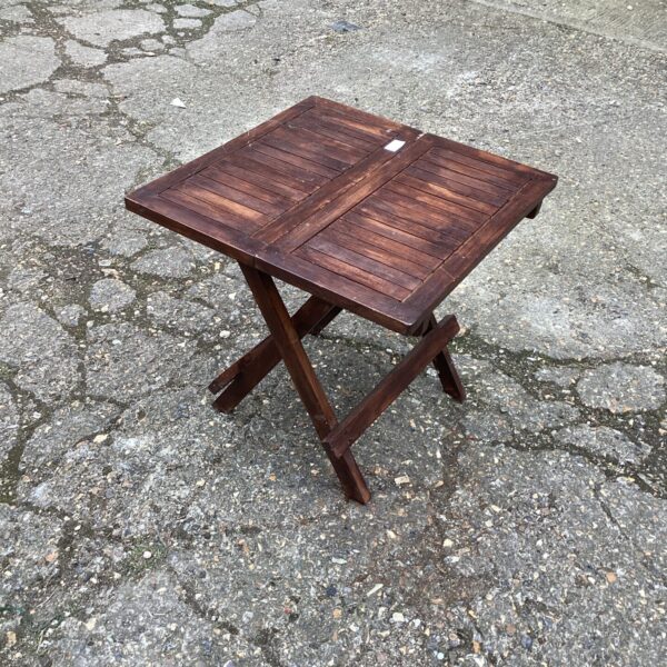 Small folding teak table for garden or patio use.