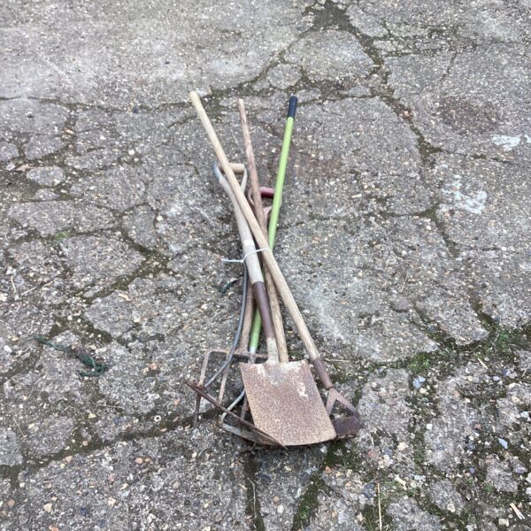 Vintage garden tool bundle with wooden handles and metal heads.