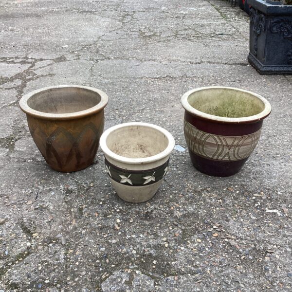 Lot of three glazed terracotta garden planters for outdoor use.