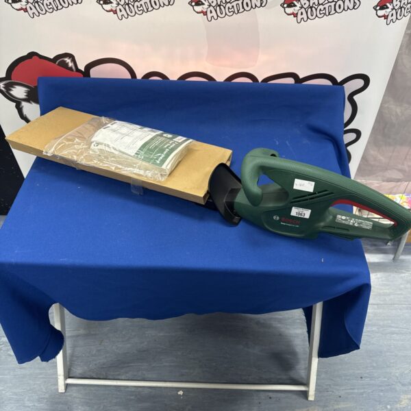 Bosch 18V cordless hedge trimmer body with manual.