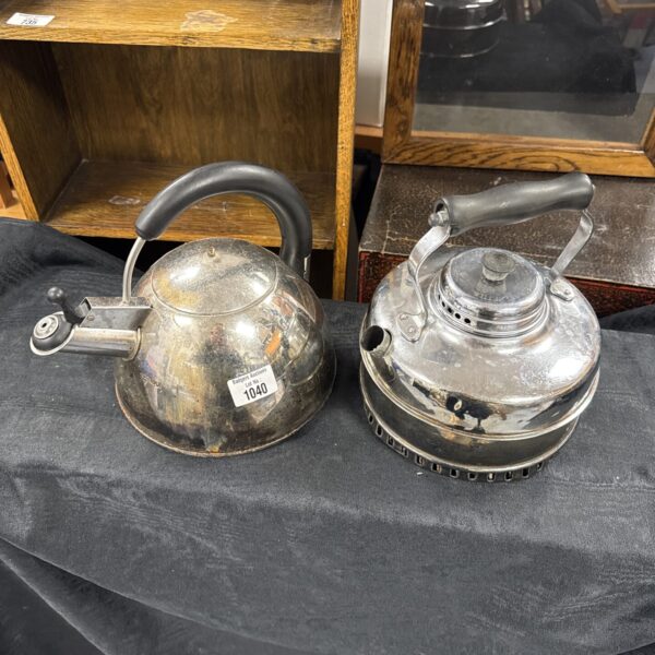 Pair of vintage enamel camping kettles for outdoor cooking.