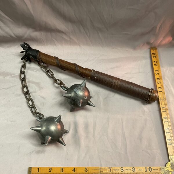 Steel flail medieval mace with wooden haft for re-enactment.
