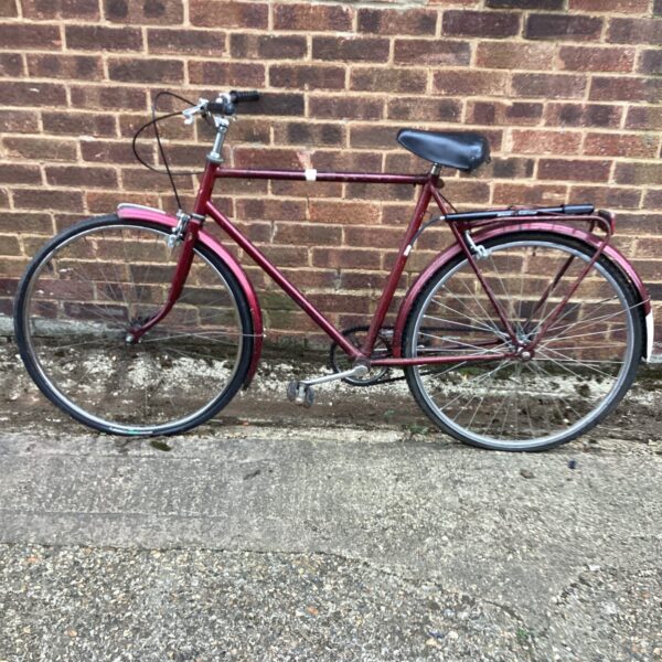 Red vintage gents bicycle, classic retro style.