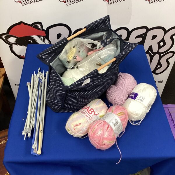 Knitting wool and needles lot for crafting projects.