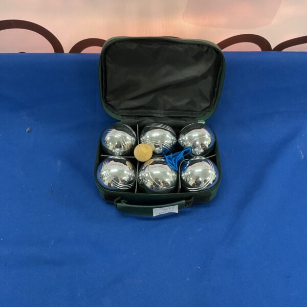 Green case containing a set of metal boules for pétanque.