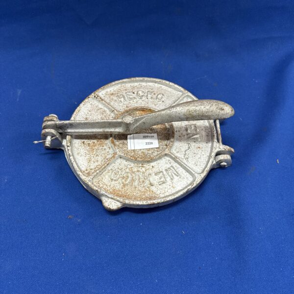 Vintage Mexican tortilla press made of cast iron.