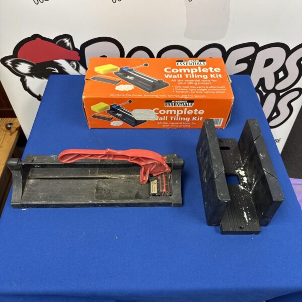 Pair of vintage manual tile cutters for ceramic flooring.