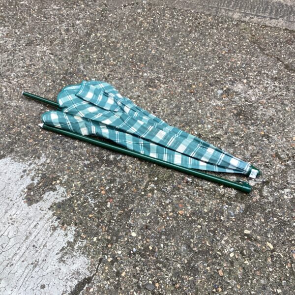 Vintage striped patio parasol for garden shade.