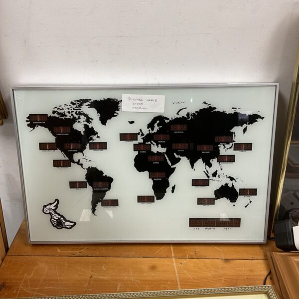 Digital world map clock displaying time zones with LED illumination.
