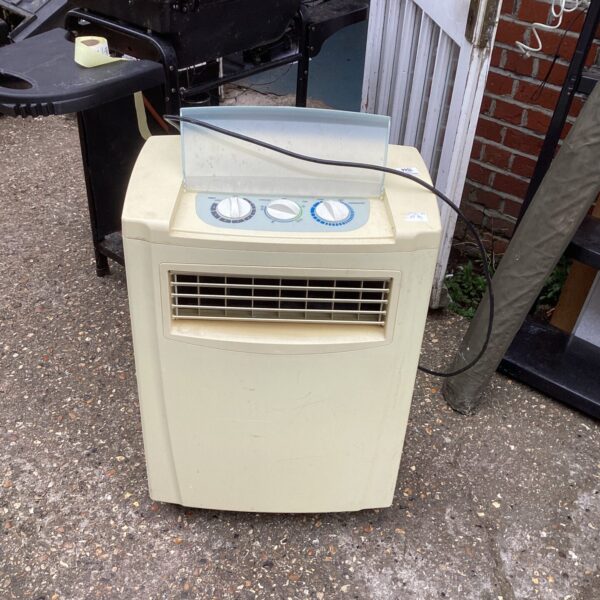 Vintage yellow air conditioner unit for collectors and restoration.