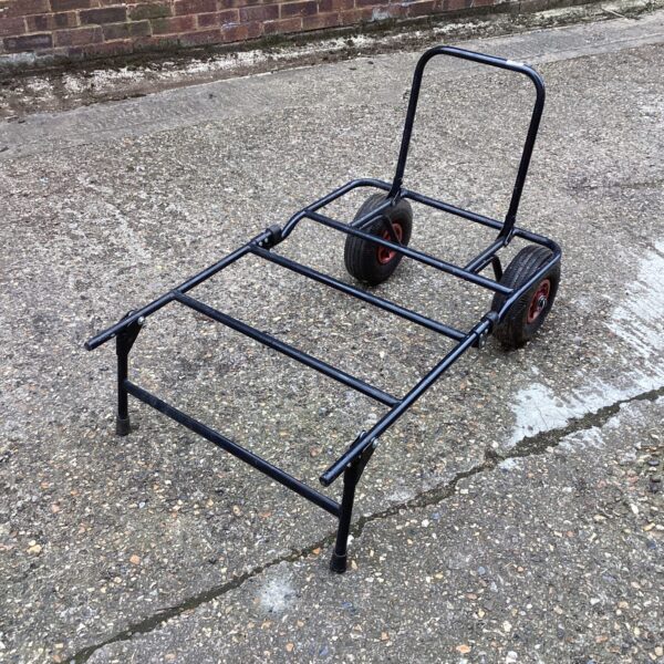 Used folding metal trolley with wheels for light transport.