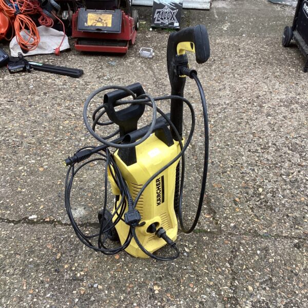 Front view of a used Karcher pressure washer for garden cleaning.