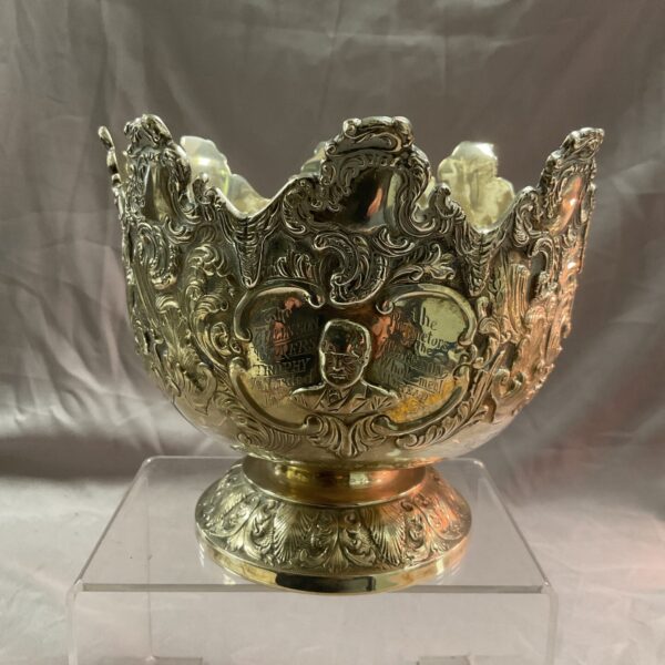 Ornate silver Monteith bowl with inscription, antique silver craftsmanship.