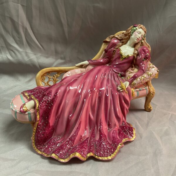Side view of the Franklin Mint Sleeping Beauty porcelain figurine.