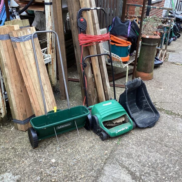 Side view of a vintage Qualcast lawnraker seeder.