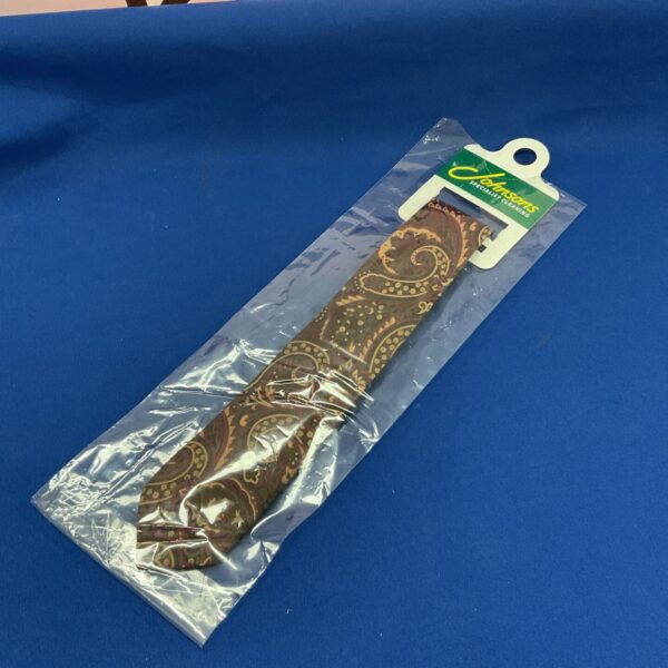 Antique Victorian paisley silk tie with intricate pattern.