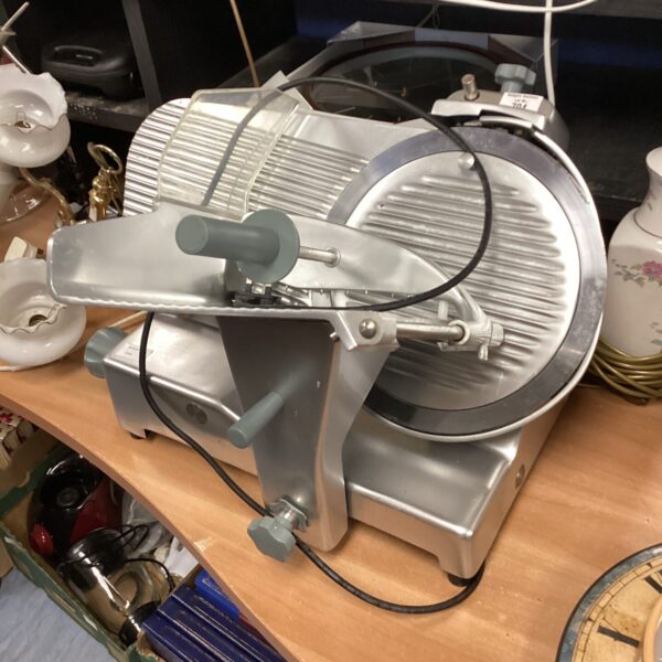 Front view of a Sirman commercial meat slicer for spares.