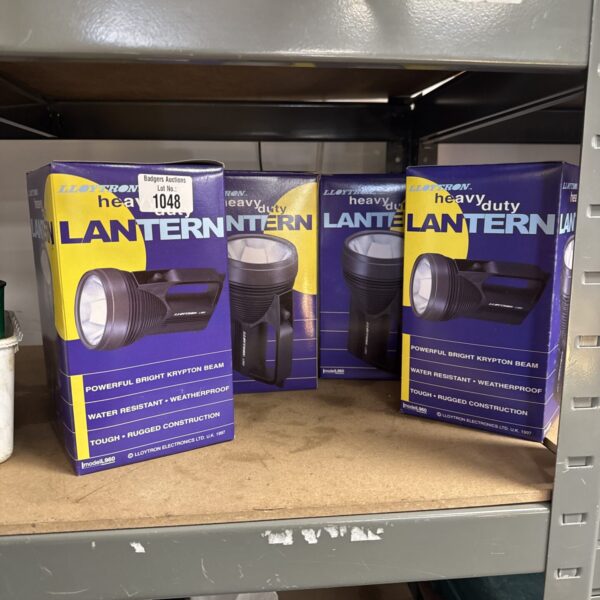 Four Lloytron heavy-duty lanterns in original packaging, vintage industrial lighting.