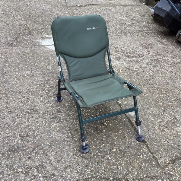 Green Chub fishing chair with adjustable legs for comfortable angling.