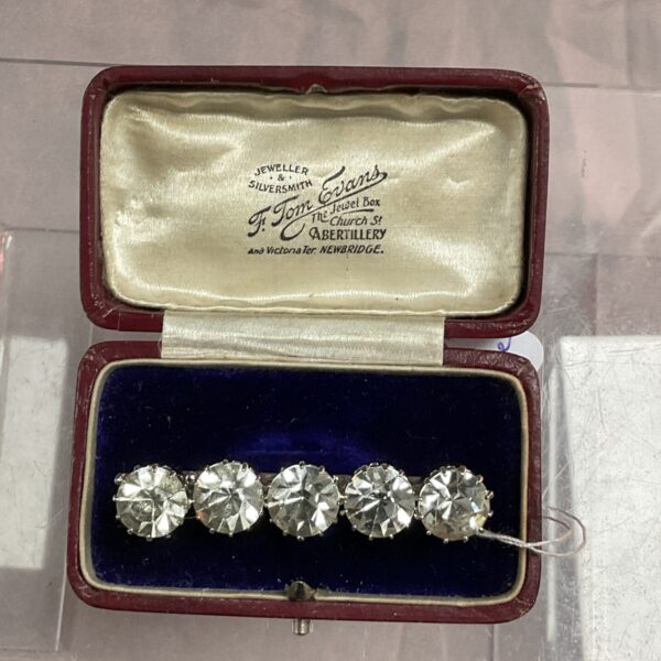 Vintage Art Deco bar brooch with five stones in original box.