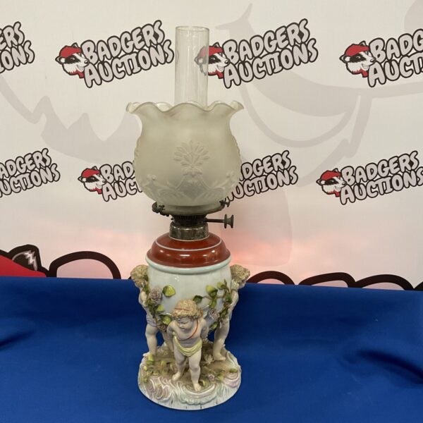 Side view of the Victorian Schierholz porcelain oil lamp.