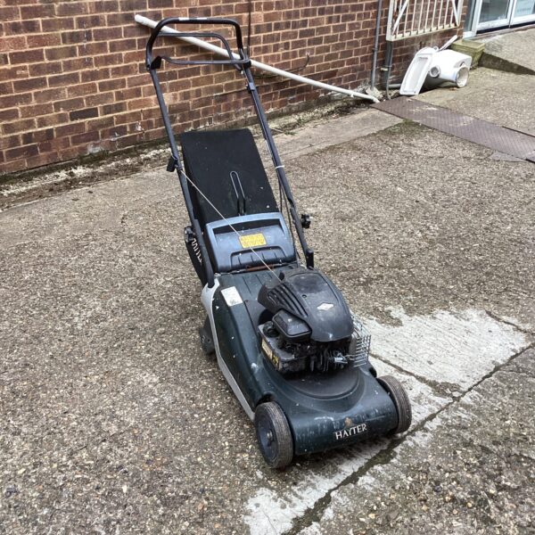 Vintage Hayter petrol lawn mower in used condition.