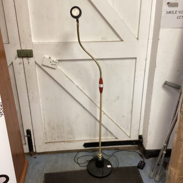 Vintage brass reading lamp with flexible gooseneck.