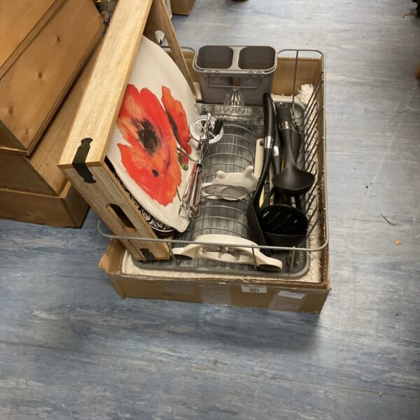 Mixed crockery and utensils lot with trays and serving dishes.