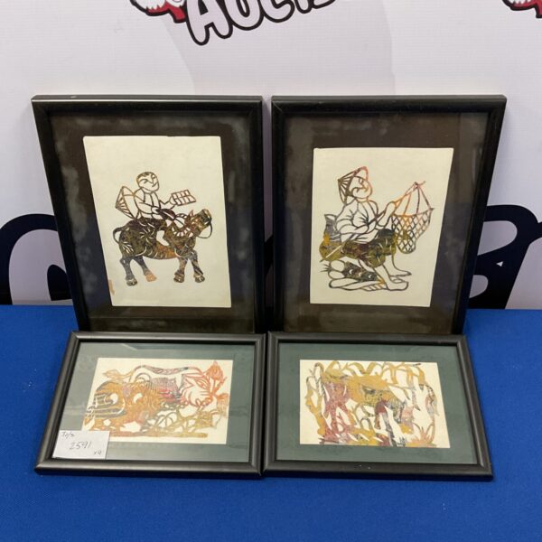 Set of four antique oriental cut paper artworks with intricate designs.