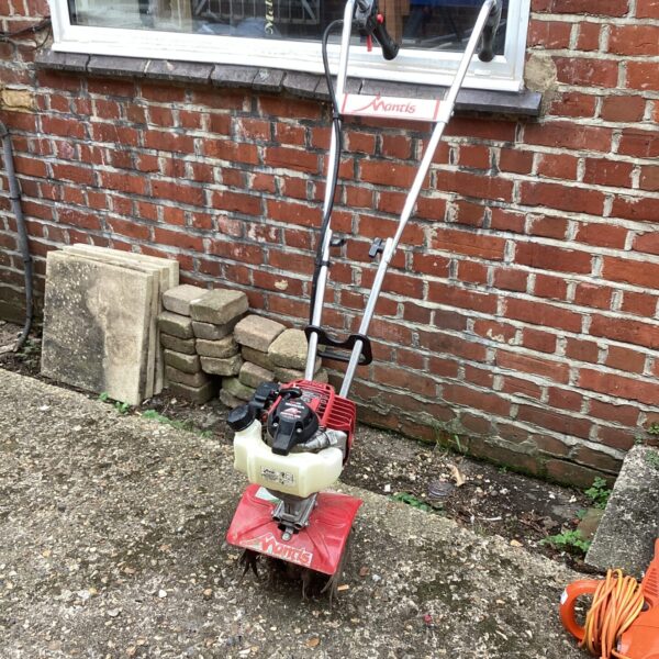 Mantis petrol rotovator for garden soil cultivation.