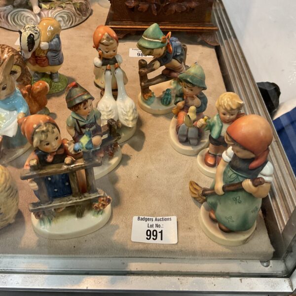 Vintage Hummel Goebel figures lot, collectible porcelain figurines.