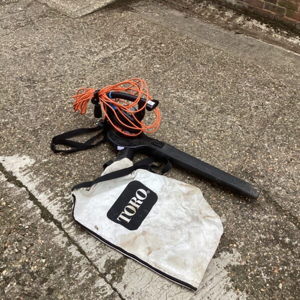 Vintage Toro lawn vac and leaf blower in used condition.