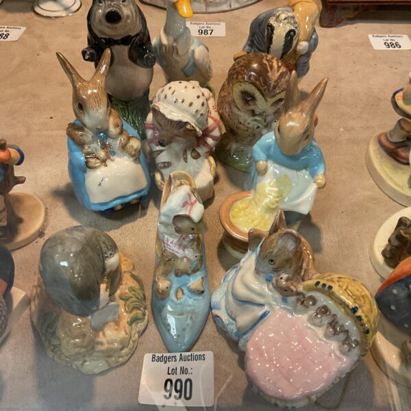 Vintage lot of ten Beatrix Potter figurines by Beswick and Royal Albert.