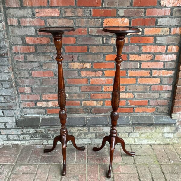 Pair of antique mahogany jardiniere stands for plants.