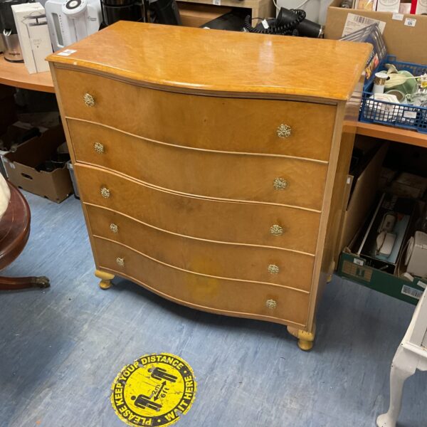 Antique birds eye maple chest of drawers with five drawers.