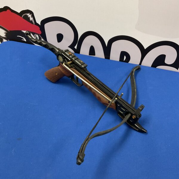 Vintage Armex crossbow pistol, a unique collectible weapon for enthusiasts.