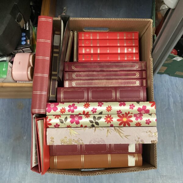 Vintage floral photo albums in a lot, ideal for collectors.