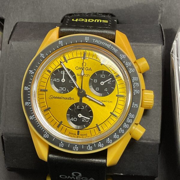 Front view of the yellow Omega Swatch Mission to the Sun bioceramic watch.