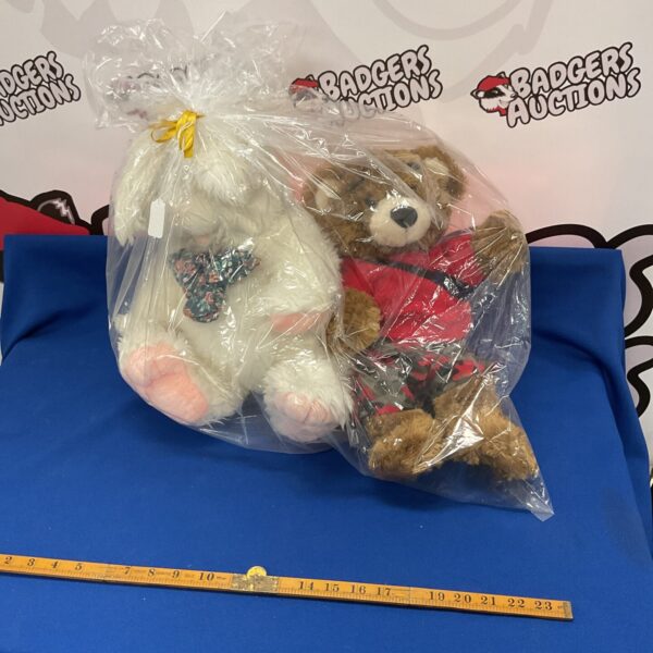 Wrapped plush toy gift set with bunny and teddy bear.