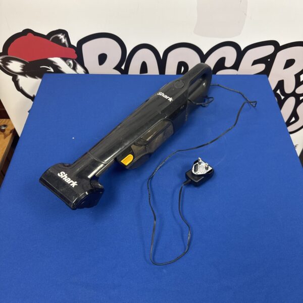 Shark cordless dustbuster with charger, handheld vacuum cleaner.