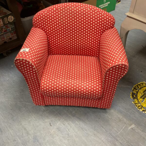Vibrant polka dot childrens armchair on wheels by Dunelm.