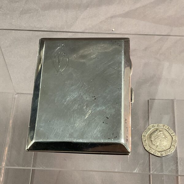 Vintage sterling silver cigarette case, hallmarked 1925, front view.