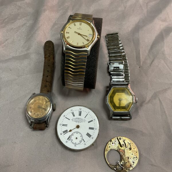 Vintage Ebel wristwatch with gold-tone case and textured band.